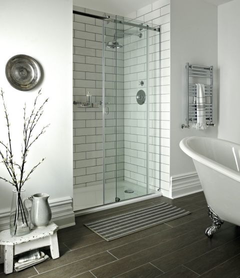 Turn an awkward alcove in a bathroom into a walk-in shower. Fired Earth's Lotus Flower sliding door enclosure comes in various sizes or can be made bespoke to fit your space perfectly. Retro-style wall tiles finished with grey grout create a smart utilitarian look.
Get the look: Lotus Flower sliding door enclosure, £1,300; Avebury concealed shower, £1,135; Retro Metro tiles in South Kensington, £79.99 a sq metre; similar wood-effect porcelain flooring, Rye Harbour in Old Oak, £94.85 a sq metre; all Fired Earth
