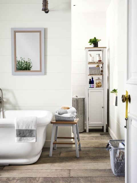 A stud wall can easily be erected by an FMB builder to divide a large bathroom and create a shower area. For a relaxed country look go for freestanding furniture paired with rustic baskets. Choose tall units that don't take up much floor area. Open shelving creates an airy, spacious feel, but keep it neat and only display decorative jars and bottles.
Get the look: Blakeney tall boy, £285; Rattan bin, £90; stool, £85; mirror, £95; all Croft collection at John Lewis
