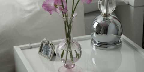 Sweetpea flowers on bedside table