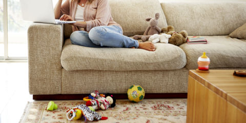 Woman working from home in messy environment