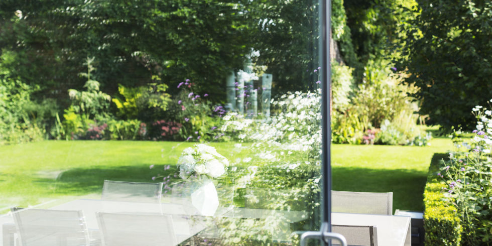 View of landscaped garden through open door
